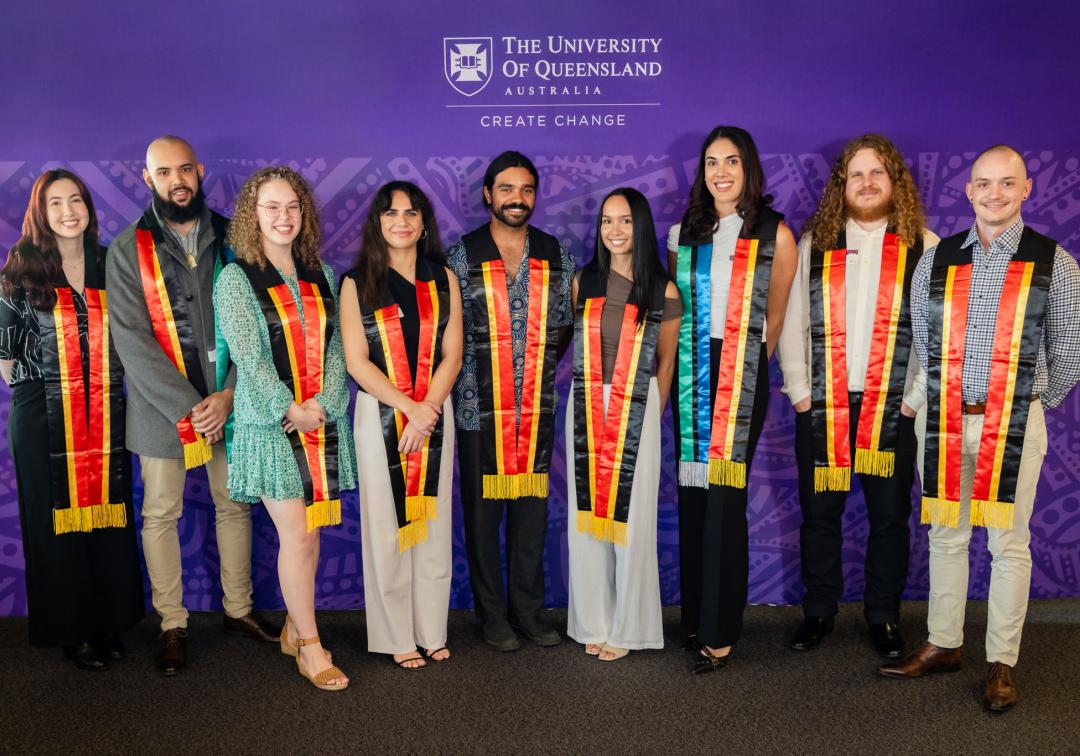 Nine graduands pose with Aboriginal and Torres Strait Islander sashes